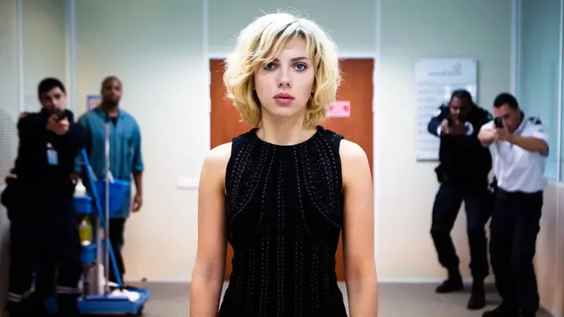Lucy calmly walking past armed police officers as her abilities grow