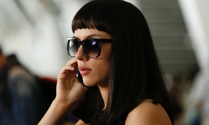 Lucy wearing dark hair and sunglasses while tracking the CPH4 couriers