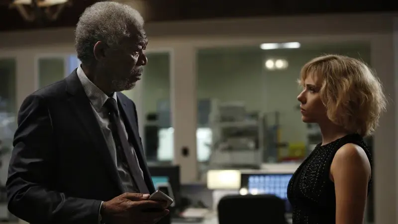Lucy speaking with Professor Samuel Norman about her expanding abilities