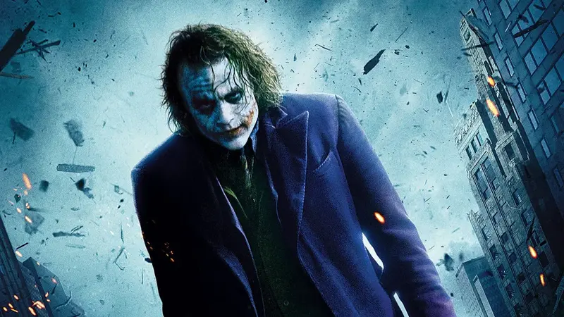 The Joker stands amid flying debris in The Dark Knight (2008)